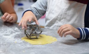 Children baking biscuits