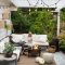 Kids enjoying winter under a patio, warming themselves by a fire pit